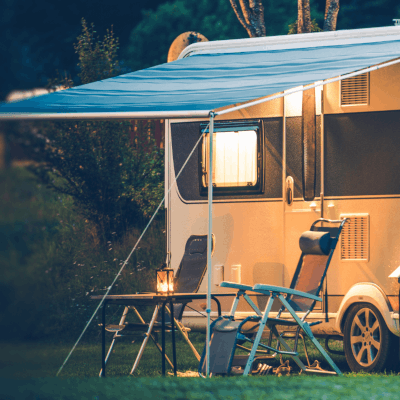 A comforting image of 2 chairs outside a caravan protected by Moving Intelligence tracking systems designed for caravans.